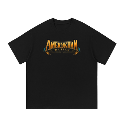 Front of black heavyweight cotton tee with the gold Amerukhan Basics wordmark across the chest, Cowardly Lion Wordmark Edition Oz shirt