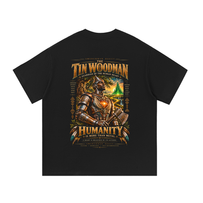 Back print: the Tin Woodman, a regal Black guardian in engraved silver and bronze armor with a glowing heart, Black heritage Wizard of Oz graphic tee