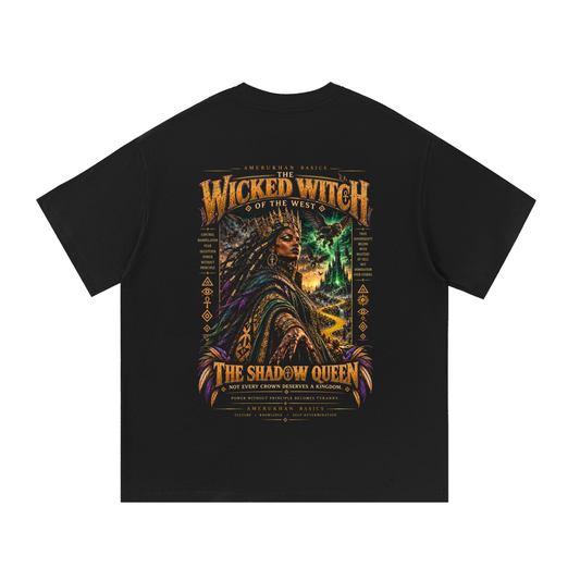 Back print: the Shadow Queen, a powerful Black queen in emerald and violet robes before a storm-lit castle, Wicked Witch Wizard of Oz graphic tee