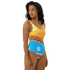 Picture of a woman in our Adinkra Sunset One-Piece Swimsuit from Amerukhan Basics looking over her shoulder.